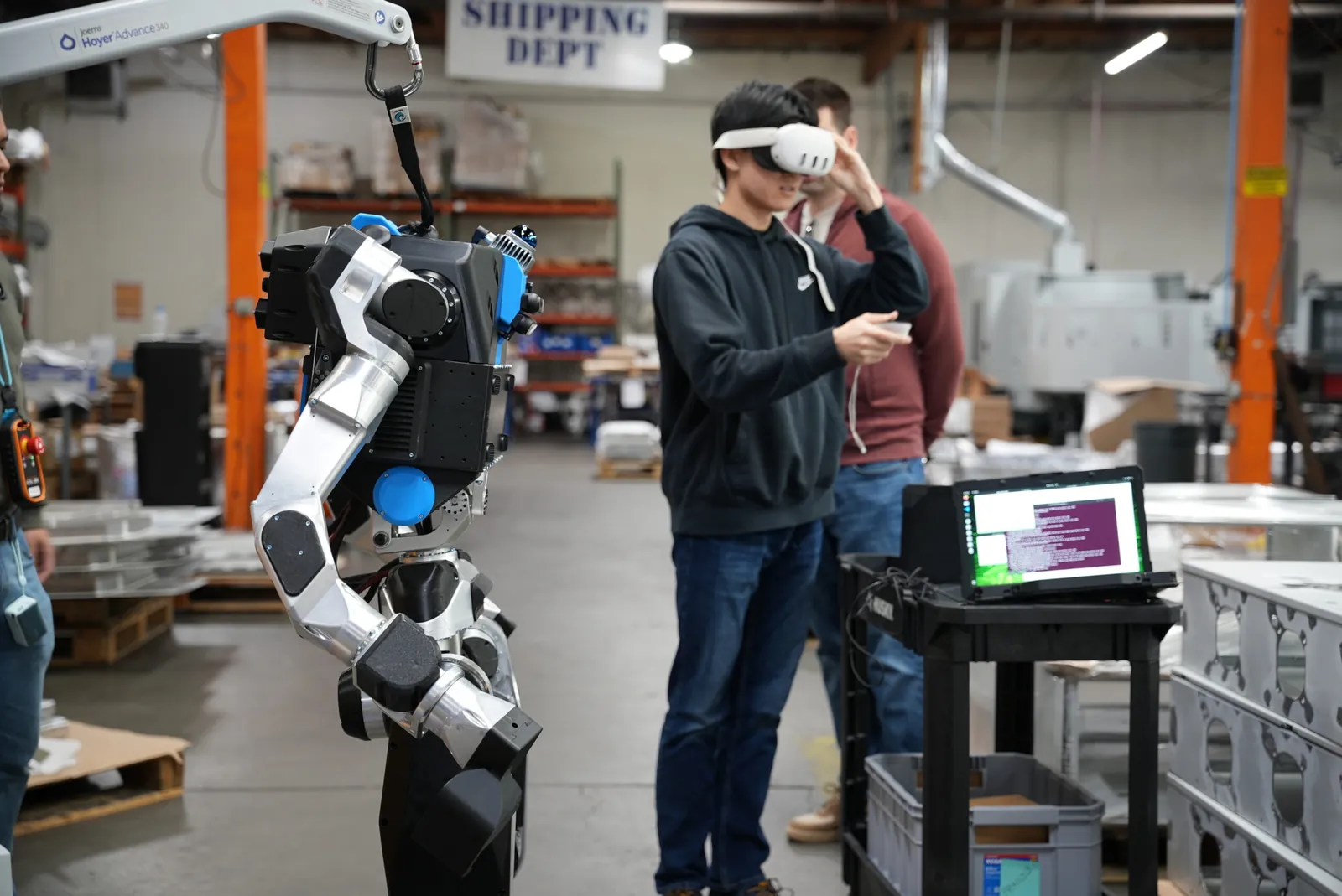 Moby with a teleoperator in VR on the factory floor